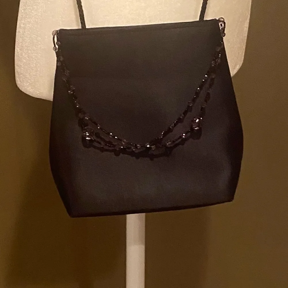 Black Elegant Bag With A Little Beading Hanging In Front